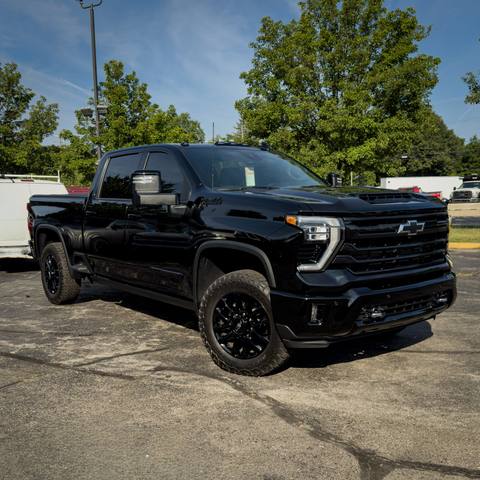 Black Chevrolet Silverado pickup with a deep gloss finish